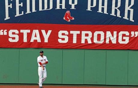 Red Sox starting pitcher John Lackey warmed up in the outfield before Game 2 of the ALDS against the Rays.
