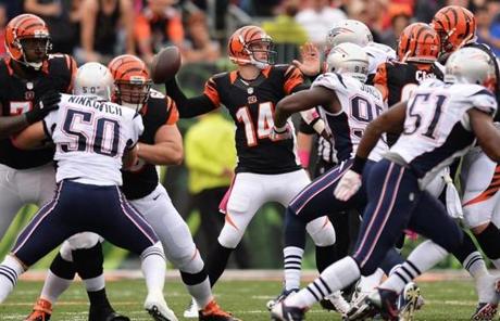 Andy Dalton looked for a receiver while under pressure.
