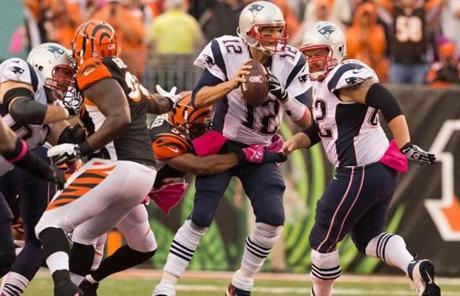 Tom Brady was wrapped up by the Bengals’ Chris Crocker and sacked during the fourth quarter.
