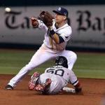Pinch runner Quintin Berry steals second base in the eighth inning ahead of the throw to the Rays’ Ben Zobrist.