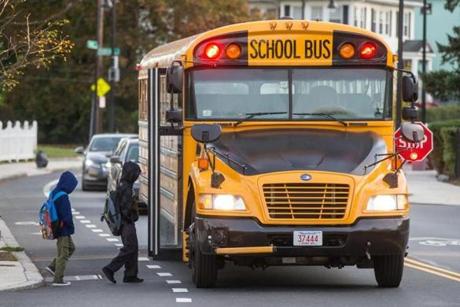 Students boarded a school bus on River Street in Hyde Park on Wednesday morning.
