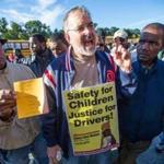 Stevan Kirschbaum, a school bus driver and a union leader, rallied co-workers on Tuesday outside the Readville bus yard. Mayor Thomas M. Menino has called Kirschbaum a “bully.”