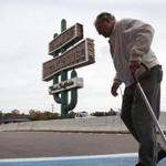 Peter Mastrangelo, who has been dining at the Hilltop Steakhouse for 50 years, walked in front of the restaurant’s iconic cactus sign.