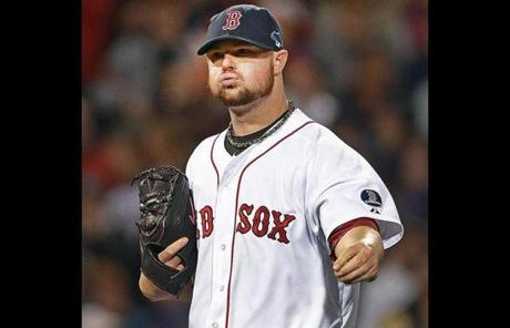 Red Sox starting pitcher Jon Lester reacted to a play in the sixth inning.
