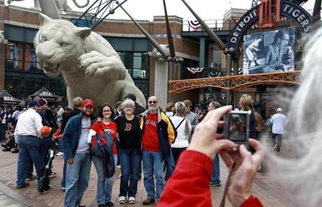 Red Sox fans posed for a photo outside Comerica Park.
