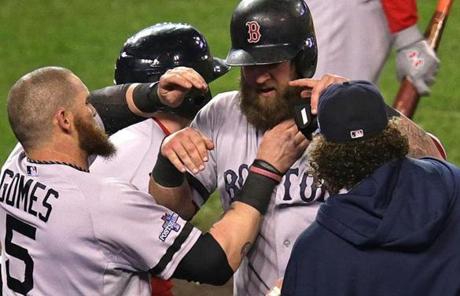 Mike Napoli's beard was pulled in celebration after Napoli scored on a wild pitch that got away from the catcher in the third inning.
