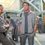 Arnold Schwarzenegger (left) and Sylvester Stallone star in the action flick “Escape Plan.”