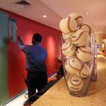 At the Hotel Commonwealth, workers painted a wall at the front desk green to resemble Fenway Park’s Green Monster and baseballs took the place of flowers in the vases. 