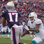 Patriots receiver Aaron Dobson hauls in a 14-yard touchdown pass after beating Dolphins cornerback Nolan Carroll in the third quarter.