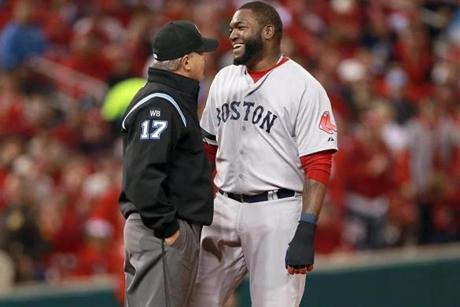 Sox slugger David Ortiz has a light moment with umpire John Hirschbeck in the eighth.
