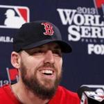 John Lackey laughed during a press conference at Fenway Park on Tuesday.