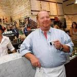 Celebrity chef Mario Batali sampled coffee during a preview tour of Eataly before its grand opening in New York City in August 2010.