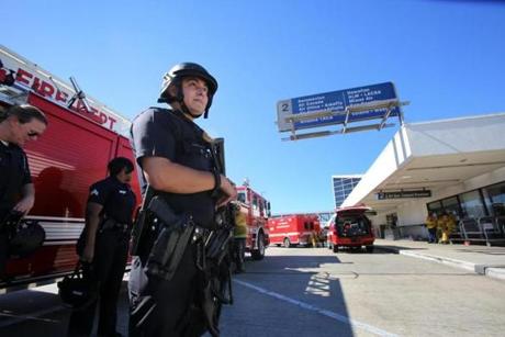 Police stood guard at Los Angeles International Airport after a gunman, identified by officials as 23-year-old Peter Ciancia, killed a TSA employee and wounded two other people. The shooting suspect is in custody, authorities said.
