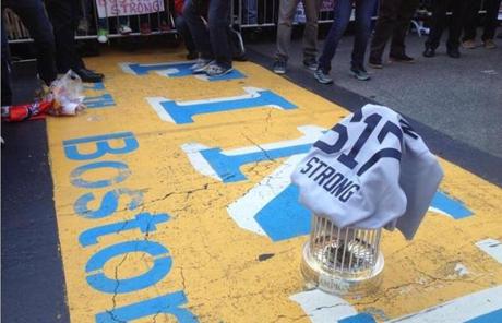 The Red Sox World Series trophy was placed on the Boston Marathon finish line during the parade.
