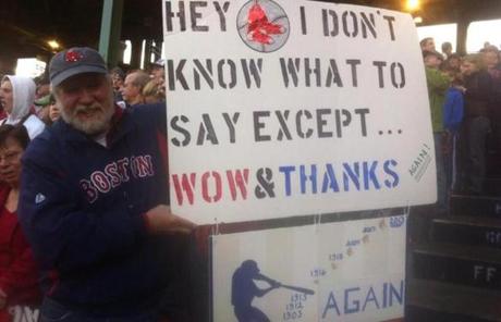 A fan held up a sign thatnked the Red Sox. 
