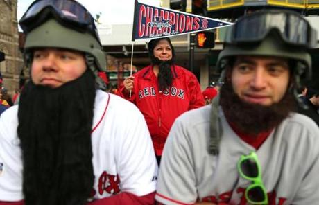 Rich Midgley (left) and his friend Nick Lanteril wore helmets and beards as fan Rita Race stood nearby.
