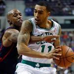 The Celtics’ Courtney Lee keeps Detroit’s Chauncey Billups away from the ball during the first half.