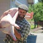 Brandon Sheard with a freshly slaughtered pig at Farmstead Meatsmith on Vashon Island, Wash. 