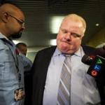 Rob Ford (right) made a statement outside his office after the release of a new video.