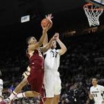 BC guard Olivier Hanlon (23 points) tries to get a shot off over Carson Desrosiers.