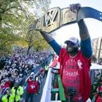 World Series MVP David Ortiz held up a championship belt at the start of the parade.