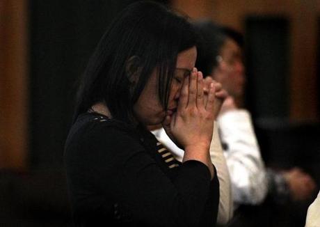 Veronica Caballero, who has family in the Philippines, prayed in Malden for victims of Typhoon Haiyan.
