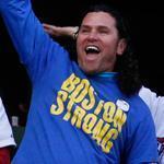 Carlos Arredondo stood and cheered at the start of the Red Sox World Series parade at Fenway Park. He has become the face of Boston Strong.