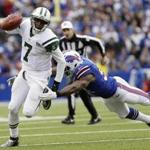 Bills linebacker Manny Lawson chased Jets quarterback Geno Smith.