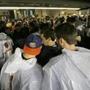 Fans sought shelter in the concourse area at Soldier Field during a severe storm  during the first half of the Ravens-Bears game.