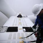 Andy Doak, a First Wind operations manager, prepared to pop up on top of a turbine at the Bull Hill wind farm.