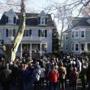 People gathered outside the home on Beals Street where John F. Kennedy was born for a ceremony to honor him.