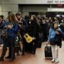 Travelers waited in line at South Station in Boston early Wednesday.
