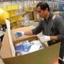 An employee packed products at an Amazon fulfillment center England.