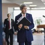 Secretary of State John Kerry picked up his notebook after answering questions from the media before his departure from Tel Aviv on Friday.
