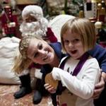 Olympic gold medalist Kayla Harrison with Meredith Healy, 3, at Copley Place Friday.