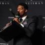 Florida State’s Jameis Winston kissed the Heisman Trophy during a press conference.