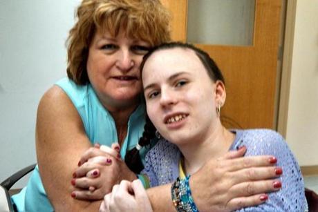 Linda Pelletier with her daughter Justina at Boston Children’s Hospital, during one of her allowed weekly visits.
