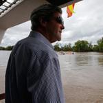 Secretary of State John Kerry rode a boat Sunday through the muddy Mekong Delta, where he once patrolled for communist insurgents on a naval gunboat.