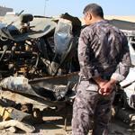 An Iraqi policeman examined a damaged vehicle after a car bomb attack on Shi’te pilgrims in Baghdad on Monday.