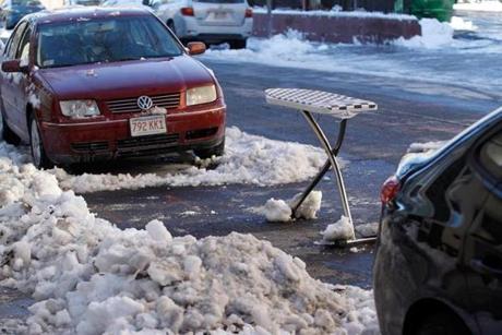 South Boston residents came up with some creative ways to defend their parking spots after Saturday’s snow storm, even though the city had not declared an official snow emergency.
