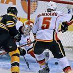 Bruin Zdeno Chara outmuscles Flames defenseman Mark Giordano to score the second of his two power-play goals, this one in the third period.