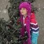 Vienna Conyngham, 9, checked out Christmas trees at a lot in the South End during Tuesday’s snowstorm,