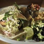 Swordfish tortillas with greens, radish, black beans and rice and melted cheddar. 