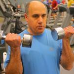 Bruce Wolfeld (top), a product manager at EMC Corp., worked out at the company’s fitness center in Hopkinton.
