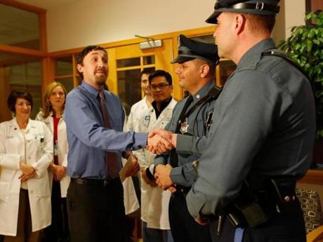 Ryan Brooker reached out to thank troopers Robert Childs and T.J. Hannon at the hospital Monday.

