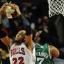 The Bulls’ Taj Gibson grabbed the ball from Jared Sullinger in the second half.