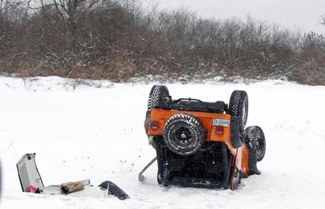 A vehicle sat upside down after a spinout on Interstate 295 in Portland, Maine.
