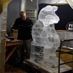 Ice sculptor Noah Burt, 25, of Rockport put the finishing touches on a piece by artist Steve Rose at Ice Effects studio in Rockland. 