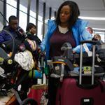 Muli Klarman, at Logan International Airport in Boston, had her flight home to Washington with her two children delayed on Saturday and again Sunday.