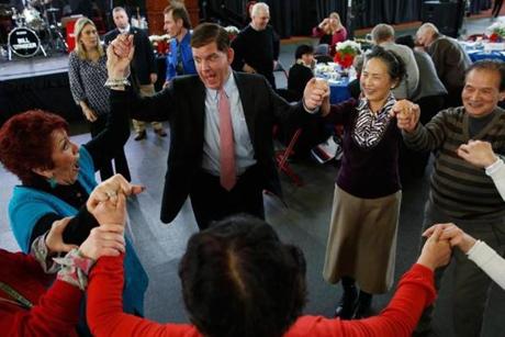 Mayor-elect Martin Walsh joined seniors in a dance at Northeastern University’s Cabot Athletic Center on Sunday.

